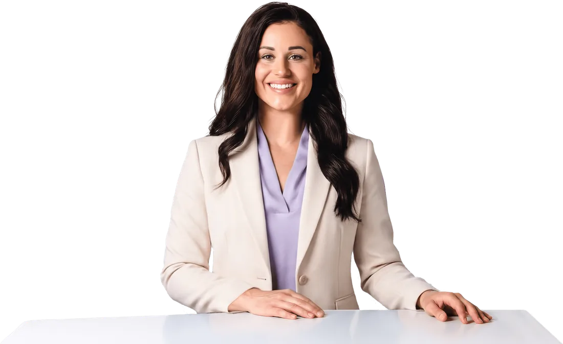 Kaitie Brinston, founder of Culture Academy, in a cream blazer with her hands resting on a table