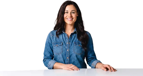 Kaitie Brinston smiling with her hands resting on a table